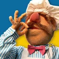 Chef muppet signalling delight and delicious schadenfreude 